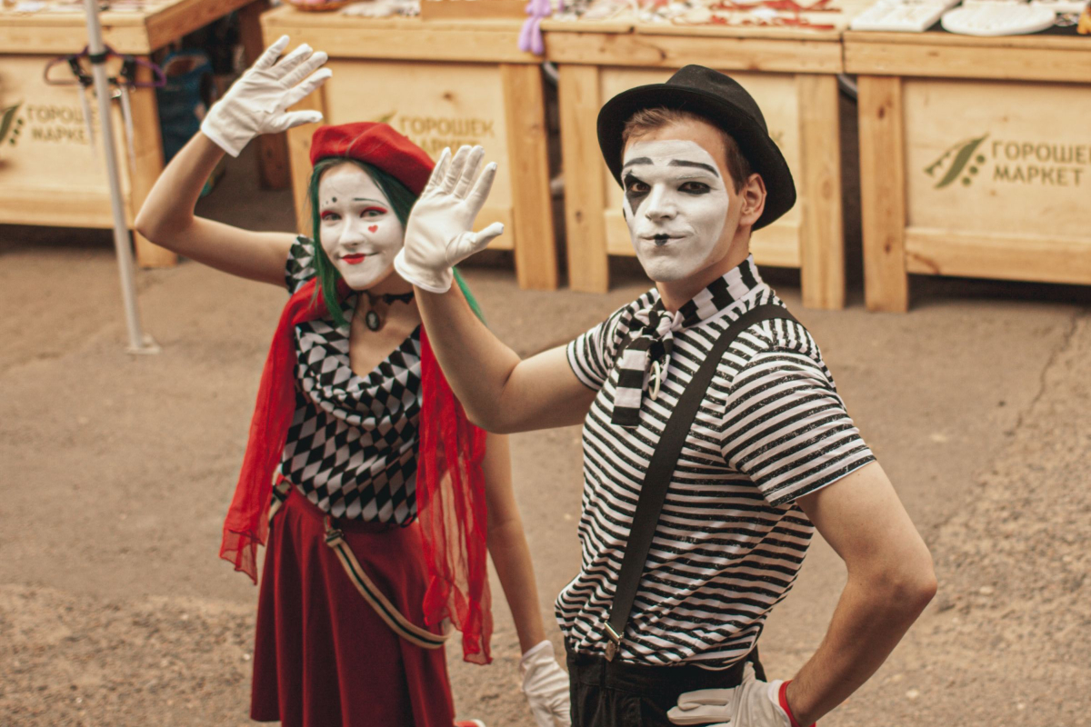 a boy and girl portraying a mime character