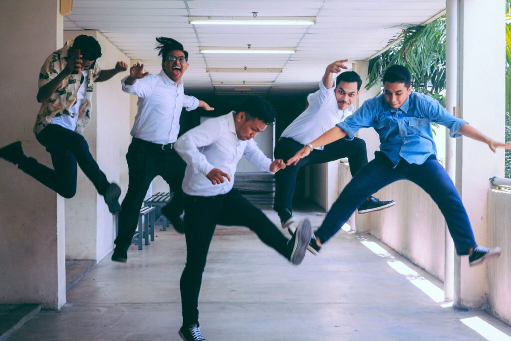 Boys jumping due to happiness
