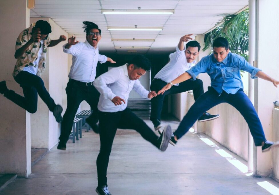 Boys jumping due to happiness