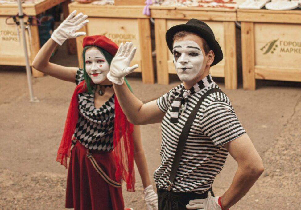 a boy and girl portraying a mime character